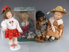 Four dolls comprising Ashton-Drake Disney Titus Tomescu Walt Disney World Girl, Mondays child, D'