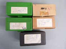 Two-hundred-and-twenty-nine .308 rifle cartridges together with 52 empty brass cases, some in