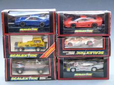 Six Scalextric model motor racing cars comprising Ferrari F40, Fenderbender Super STox C286,