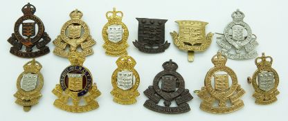Thirteen British Army Royal Army Ordnance Corps metal badges including officer's enamel and gilt