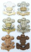 Six British Army Welsh Regiment metal cap badges