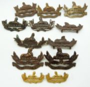 Twelve British Army Gloucestershire Regiment metal collar badges including a brass example and one