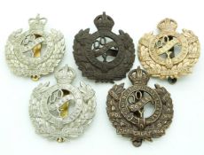 Five British Army Queen's Own Dorset Yeomanry post 1920 metal cap badges including a bronze example,