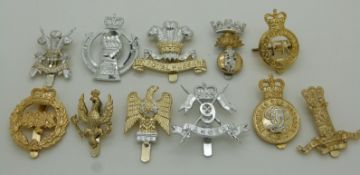 Eleven Cavalry anodised cap badges including 9th Lancers, 10th Royal Hussars, 11th Hussars and Royal