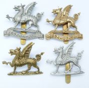 Four British Army Brecknockshire Regiment metal cap badges