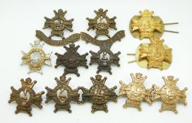 Twelve British Army Sherwood Foresters metal collar badges in four pairs plus one, including an