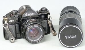 Canon A-1 SLR camera with 50mm 1:1.8 lens and Vivitar 100-300mm 1:5 lens