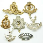Seven Ceylon metal military badges including Cadet Corps, Military Police, Medical Corps etc