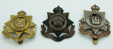Three British Army 23rd County of London Battalion officer's bronze cap badge, together with an