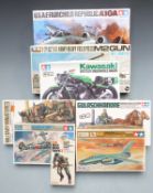 Eight Tamiya model kits including 1:48 scale USAF Fairchild Republic A10A, 1:28 scale M2 Gun, 1:12