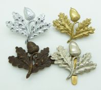 Four British Army South Notts Hussars Yeomanry metal cap badges, one example by Gaunt