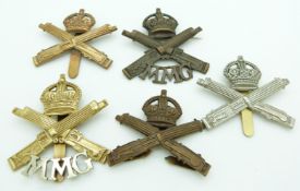 Five British Army Machine Gun Corps and Motor Machine Gun metal cap badges including two officer's