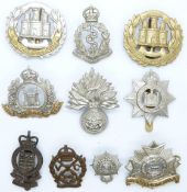Ten British Army metal cap badges including Suffolk Volunteer Corps, Suffolk Regiment,