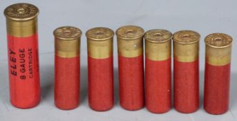 Six Eley-Kynoch 14 bore shotgun cartridges together with an Eley 8 bore cartridge. PLEASE NOTE