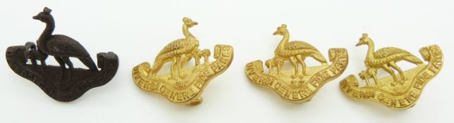 Four Northern Rhodesian Regiment collar badges including a gilt pair