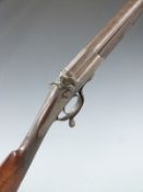 John Hanson of Lincoln 14 bore hammer action shotgun with scrolling engraving and J Hanson to the