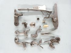 A collection of gun parts including H Akrill of Beverley percussion lock, two pinfire hammers, three