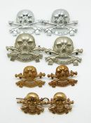 Eight British Army 17th Lancers metal badges in four differing pairs