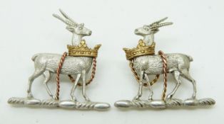 Two British Army Royal Warwickshire Regiment officer's metal collar badges