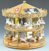 Tobin Fraley two tier American carousel with 24 ceramic horses mounted on bases, each with limited