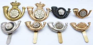 Eight British Army King's Own Yorkshire Light Infantry 'Smasher' badges