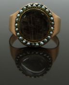 Georgian / Victorian mourning ring set with plaited hair in a glass compartment surrounded by seed