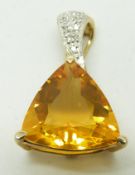 A 9ct gold pendant set with a trilliant cut fire opal and diamonds, 2.8g,