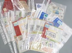 An amateur collection of uncirculated world and UK banknotes to include an AA example and