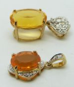 Two 9ct gold pendants set with an oval cut fire opal and diamonds, 4g