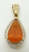 A 9ct gold pendant set with a pear cut Buriti fire opal and diamonds, 5.9g