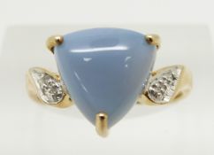 A 9ct gold ring set with a trilliant cut blue fire opal cabochon and diamonds, 2.9g, size N