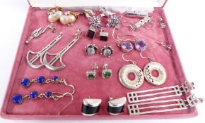A collection of silver earrings including amethyst, sodalite, etc