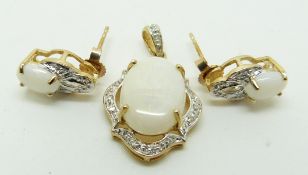 A 9ct gold pendant set with an oval opal cabochon and diamonds with a similar pair of earrings, 3.