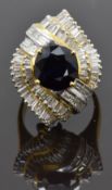 An 18ct gold metamorphic ring / pendant set with a round cut sapphire of approximately 2.2ct