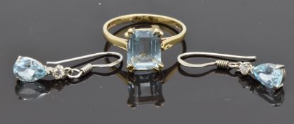 A 9ct gold ring set with a blue stone, and similar earrings