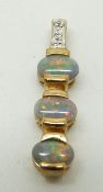 A 9ct gold ring set with three black opal cabochons and diamonds, 1.8g weight of pendant 1.7g