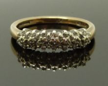 A 9ct gold half eternity ring set with diamonds, size P, 2.7g