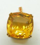 A 9ct gold pendant set with a cushion cut fire opal, 5.8g