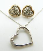 A 9ct white gold heart pendant set with diamonds and a pair of 9ct gold earrings, 3.2g