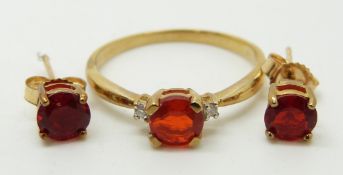 A 9ct gold ring set with a round cut Salamanca fire opal and diamonds (size N) and a pair of 9ct