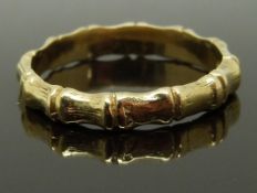 A 9ct gold ring with bamboo effect, size P, 2.53g