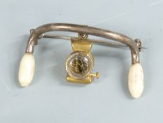 Early 20thC  cycling interest brooch formed as a pair of handlebars with lamp below, width 3.5cm