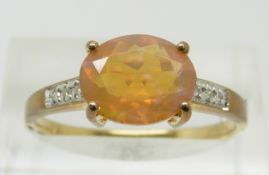 A 9ct gold ring set with an oval cut opal and diamonds,  2.1g, size S