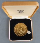 Royal Mint Queen Elizabeth Silver Jubilee gold plated commemorative coin, 45mm, cased