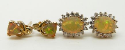 Two pairs of 9ct gold earrings each set with an opal
