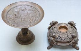 Bronze tazza decorated with Roman scenes, height 14cm and a cast metal inkwell