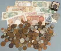 A collection of UK and overseas coins and banknotes, coin holder etc in a cash tin, small silver