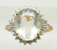 A 9ct gold ring set with an oval cut ice opal surrounded by zircon, 2.8g, size S