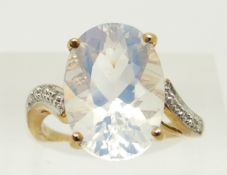 A 9ct gold ring set with an oval cut ice opal and diamonds, 3.6g, size N
