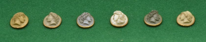 A set of six Victorian lava cameo buttons, each set with oval vari-coloured lava cameo panels carved